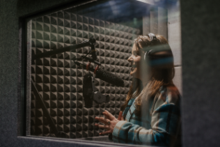 A voice over actor in the booth